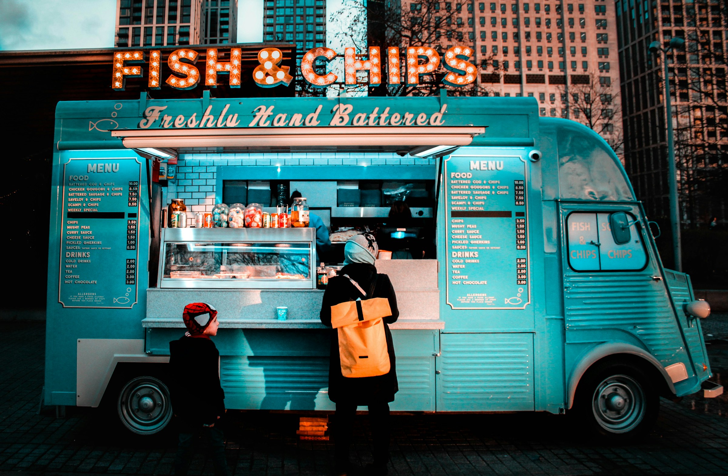 Food truck and café side by side at a market